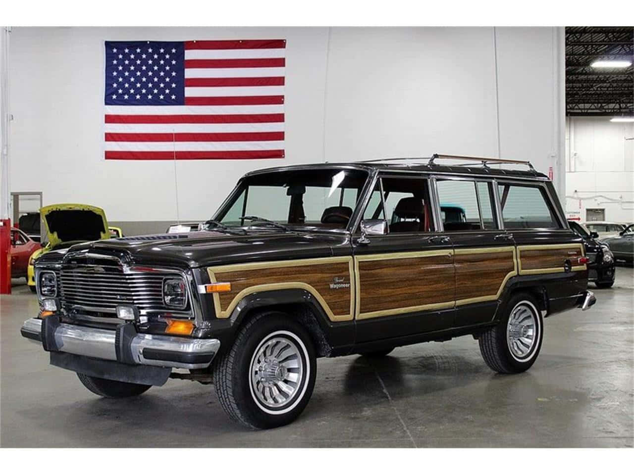 Classic Jeep Wagoneer On A Mountain Trail Wallpaper