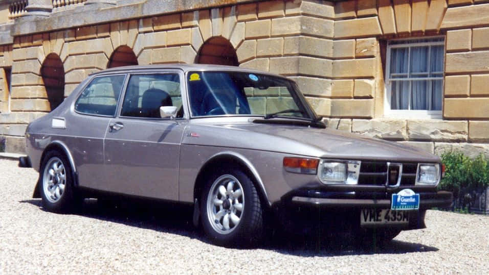 Classic Saab 99 On Country Road Wallpaper