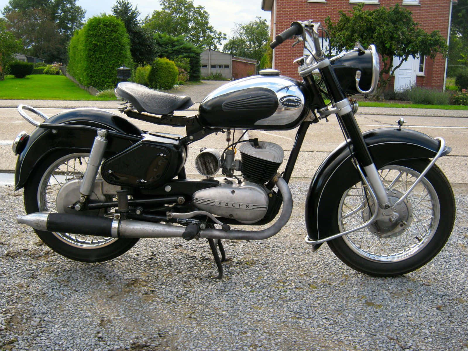 Classic Sachs Motorcycle Against An Urban Landscape Wallpaper