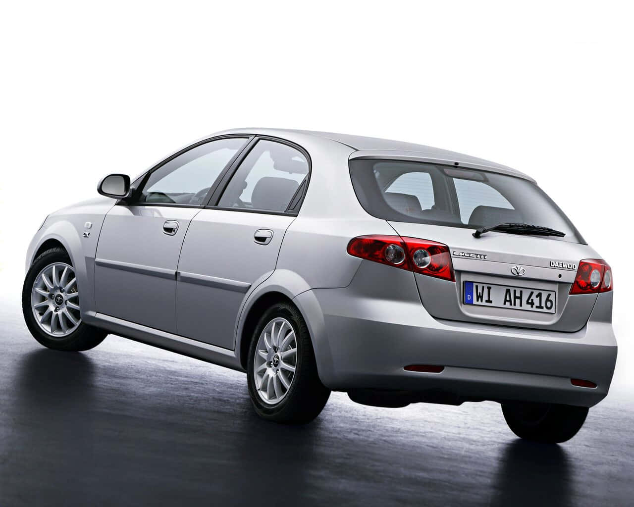 Classy Daewoo Lacetti In A Mesmerizing City Lights Atmosphere Wallpaper