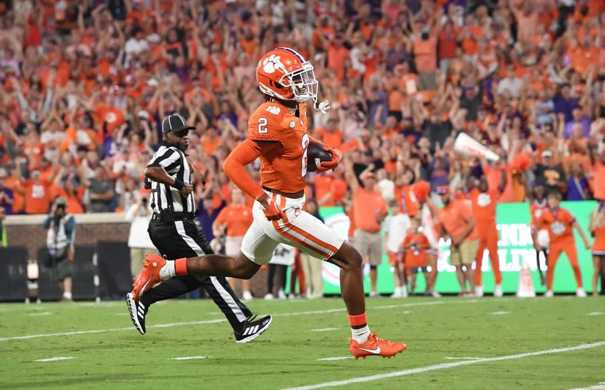 Clemson Football Player Scores Touchdown Wallpaper