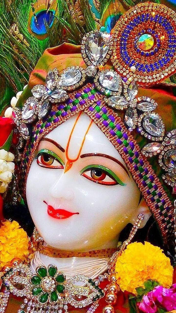 Closeup Statue Of Krishna Ji Wallpaper