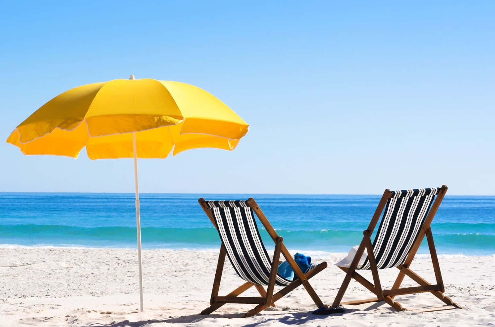 Colorful Beach Umbrella On A Sunny Day Wallpaper