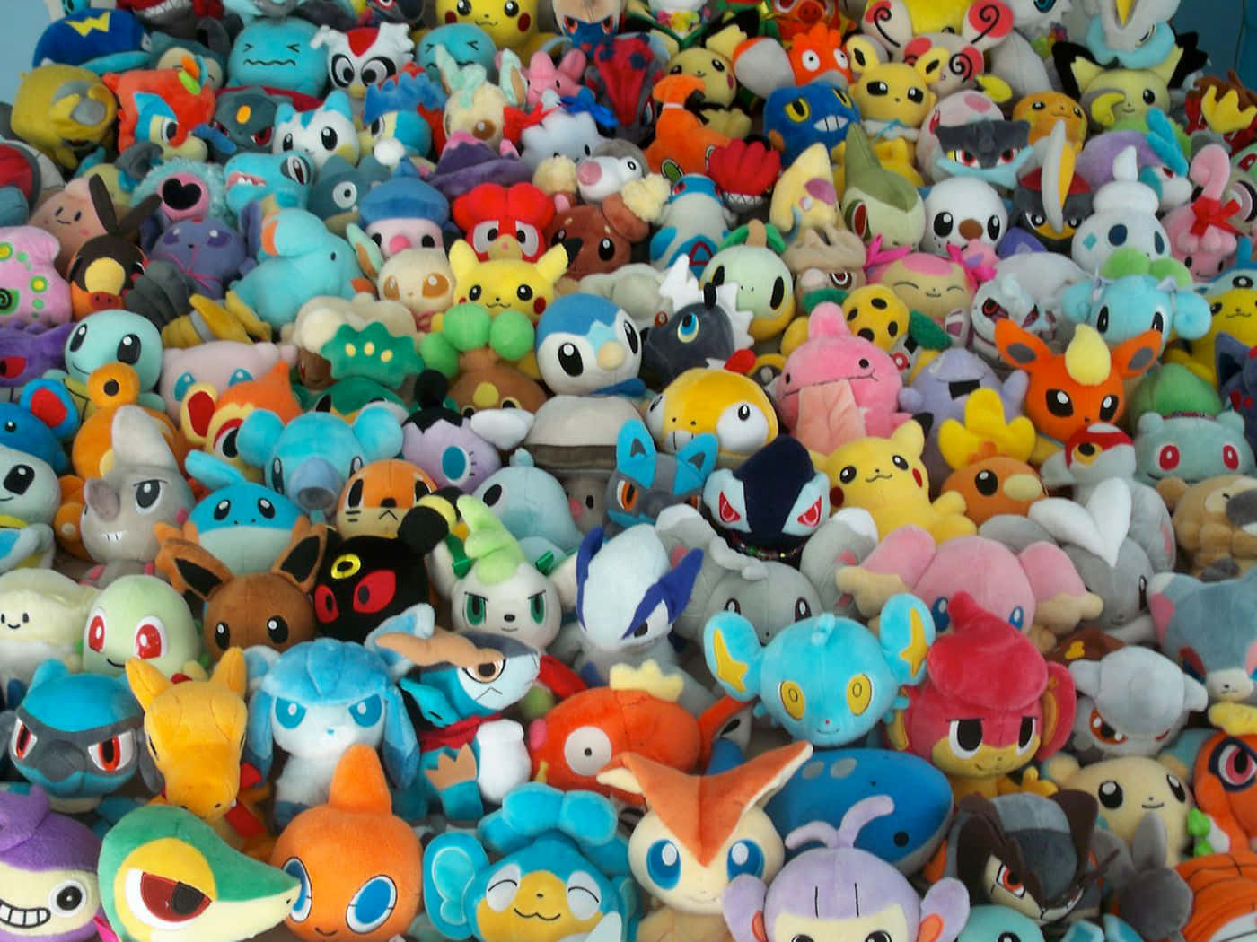 Colorful Collection Of Pokemon Toys Wallpaper