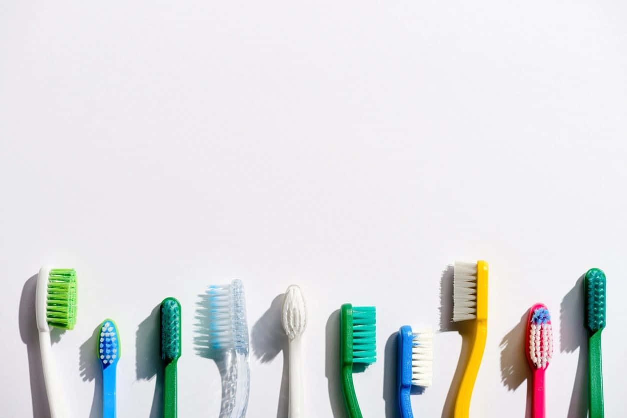 Colorful Toothbrushes Arrangement Wallpaper