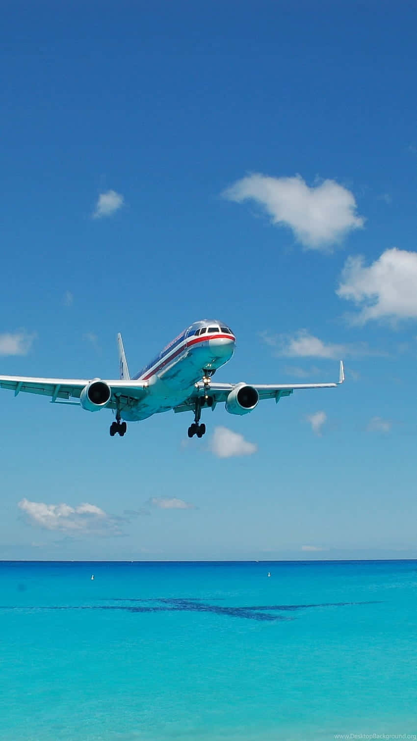 Commercial_ Airplane_ Landing_ Tropical_ Waters.jpg Wallpaper