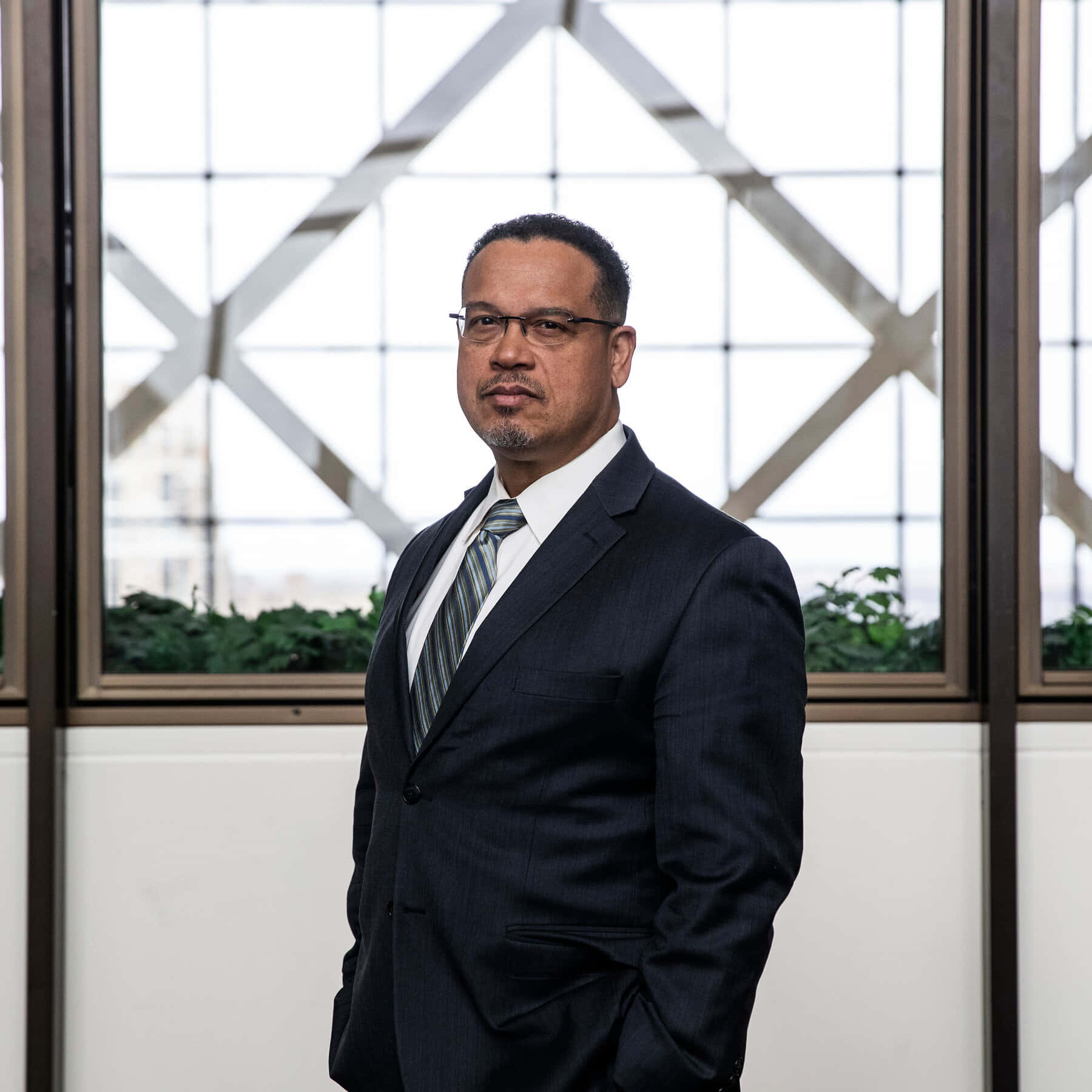 Congressman Keith Ellison Reflects Near Glass Windows Wallpaper