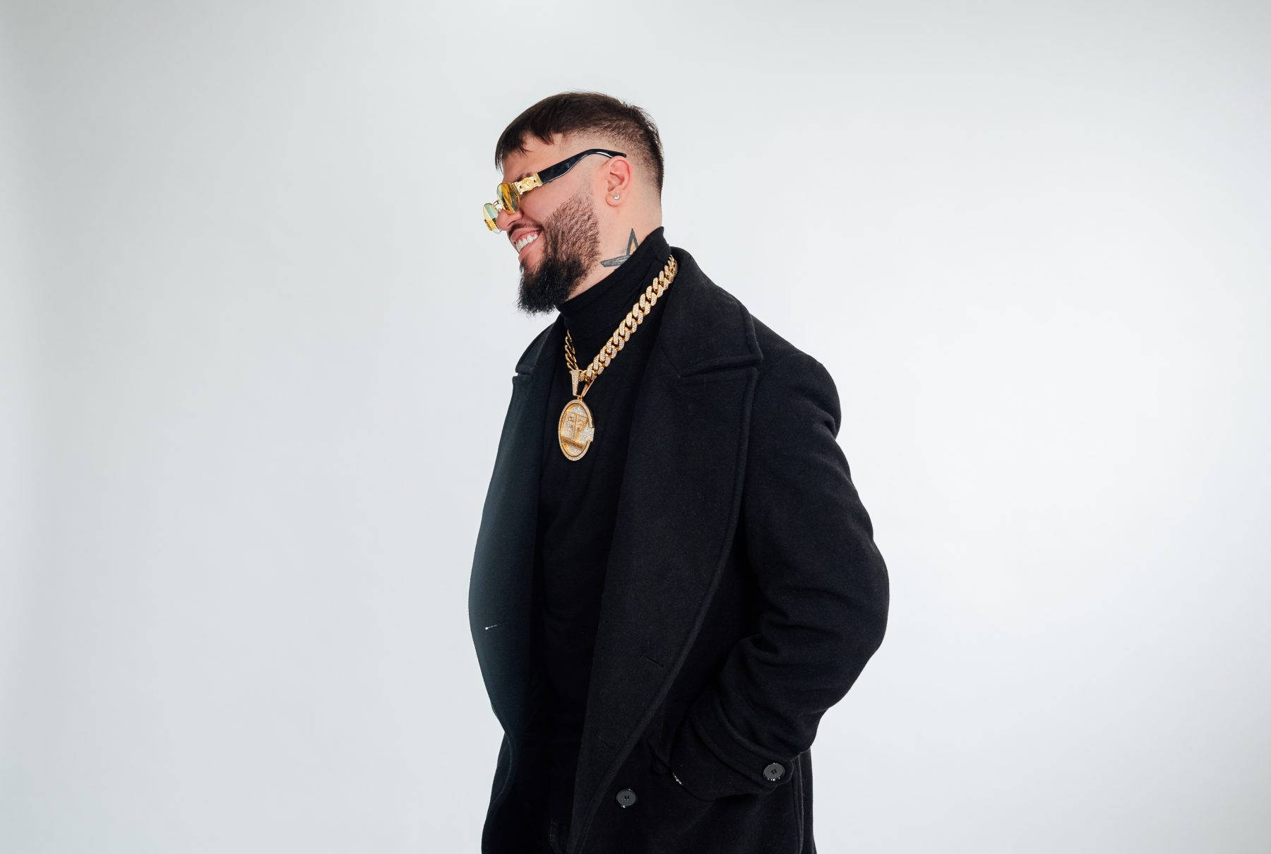 Cool Farruko On Black Trench Coat Wallpaper