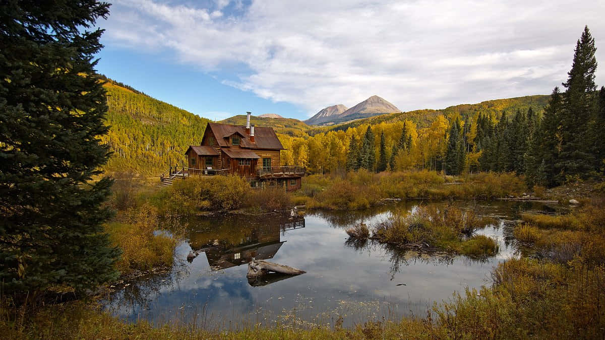 Cozy Fall Cabin In The Woods Wallpaper