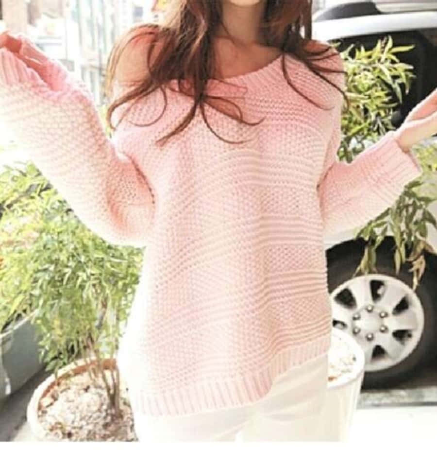 Cozy Pink Sweater On A Hanger Wallpaper