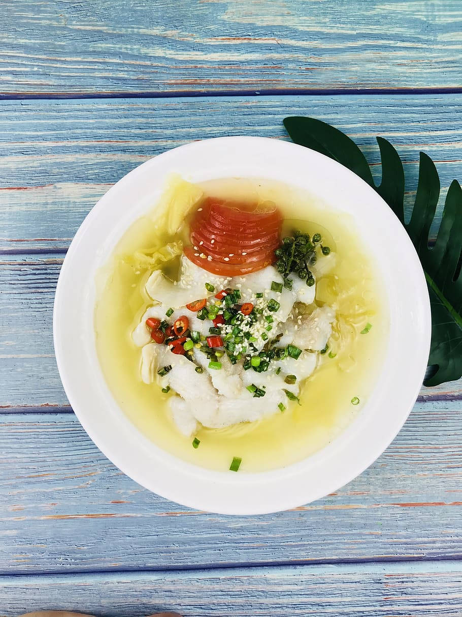 Creamy Bouillabaisse Dish On Painted Wooden Table Wallpaper