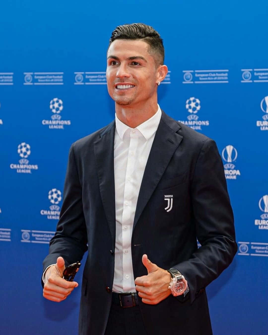 Cristiano Ronaldo Elegant Suit Champions League Event Wallpaper