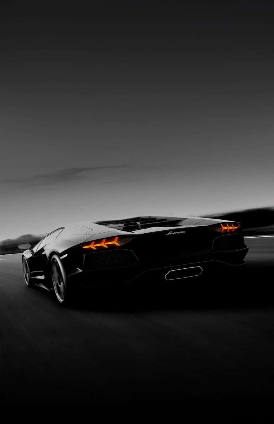 Cruise Down The Autobahn In Style In A Black Lamborghini. Wallpaper