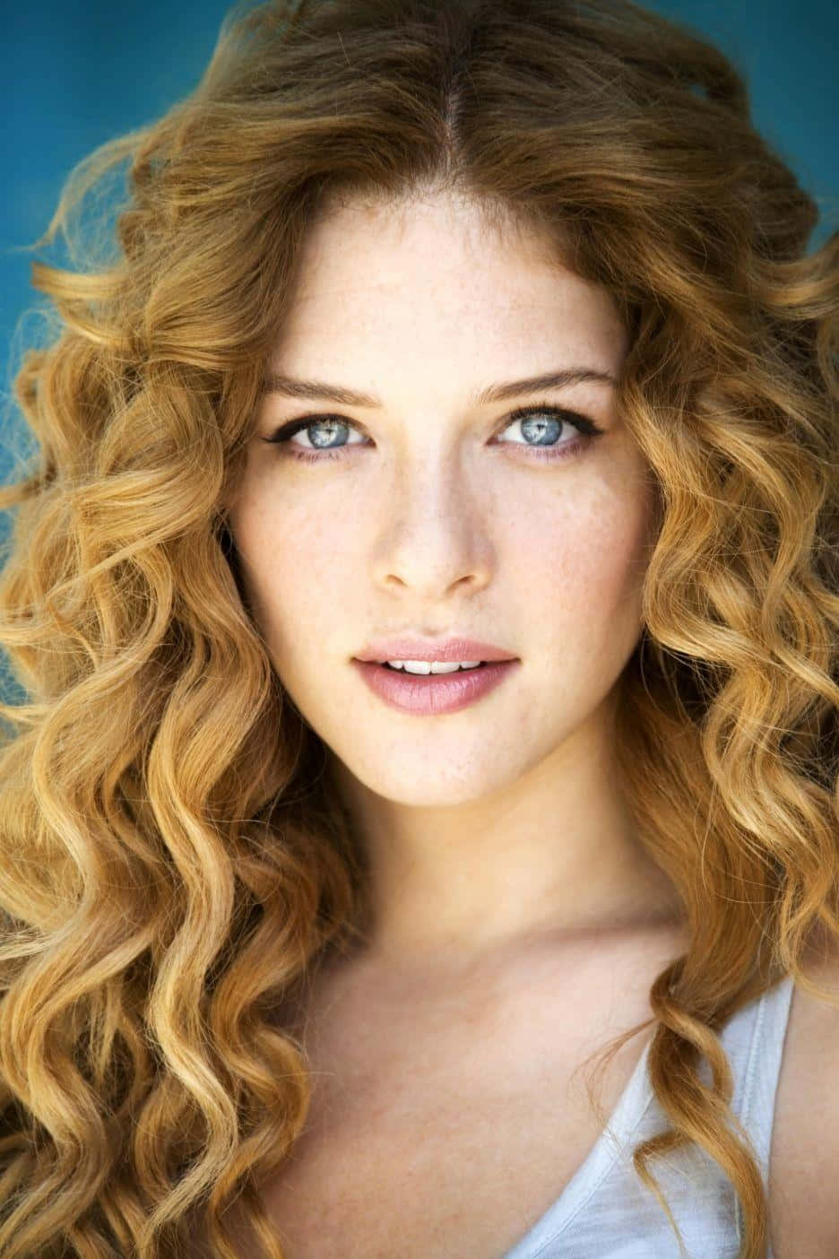 Curly Haired Woman Blue Eyes Wallpaper