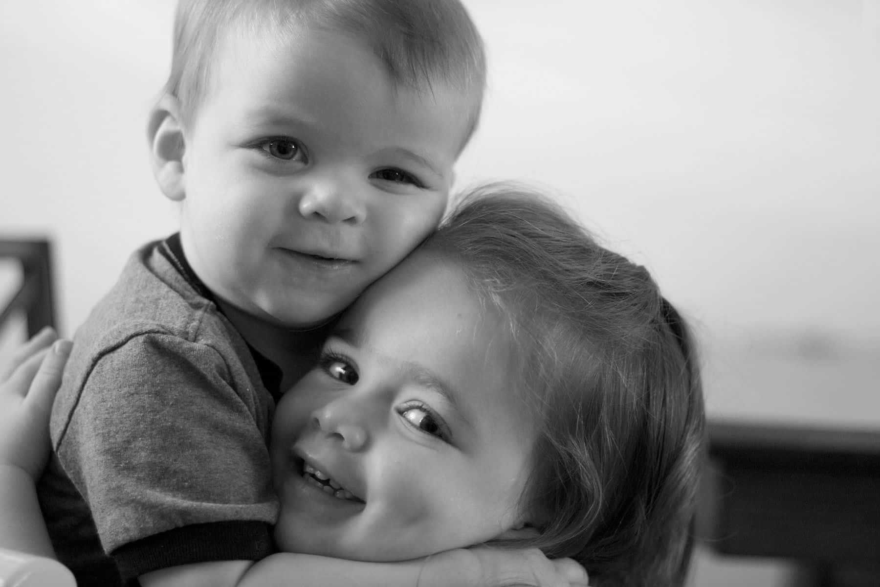 Cute Baby Couple Cuddling Black & White Wallpaper