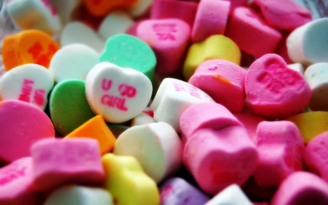 Cute Candies Cut In Hearts Wallpaper