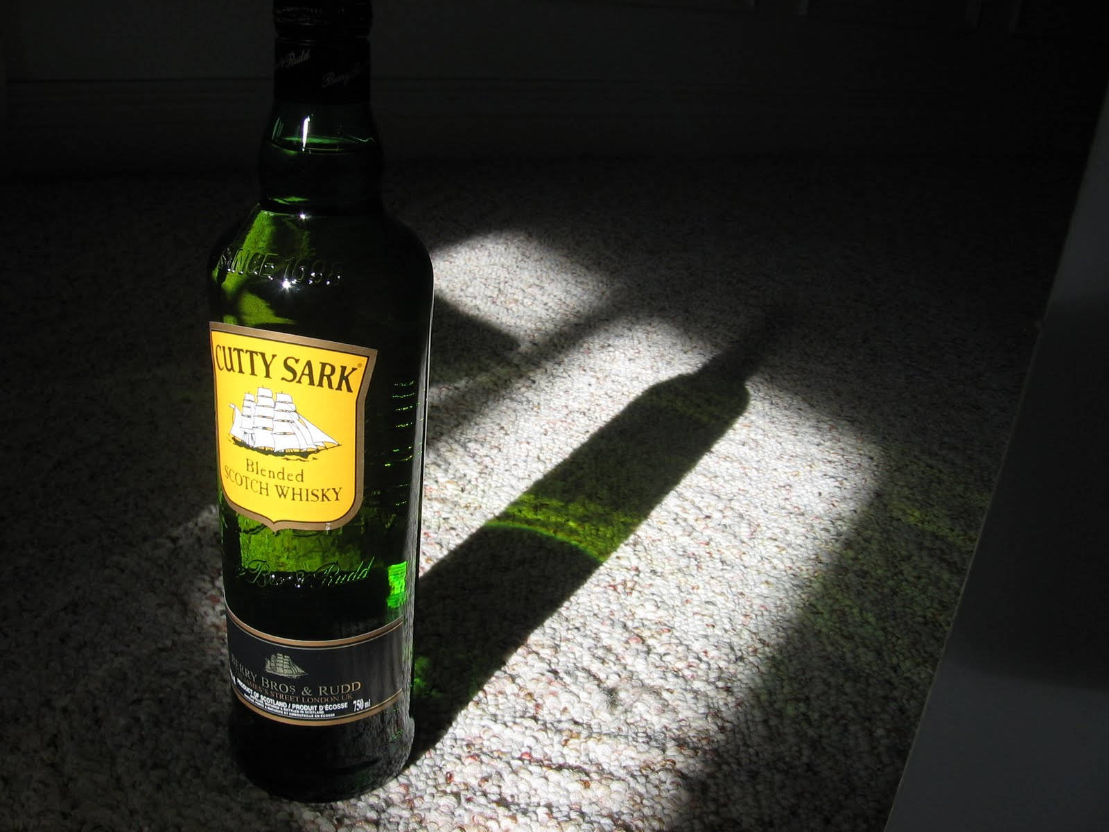 Cutty Sark Whiskey Bottle Window Shadow Wallpaper