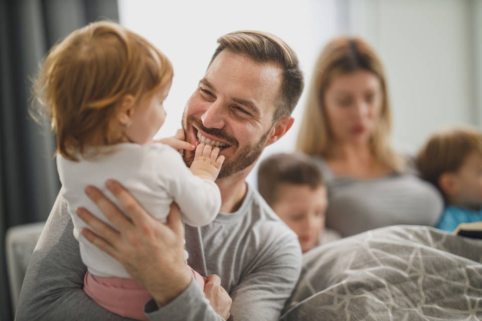 Dad Laughing With Daughter Wallpaper