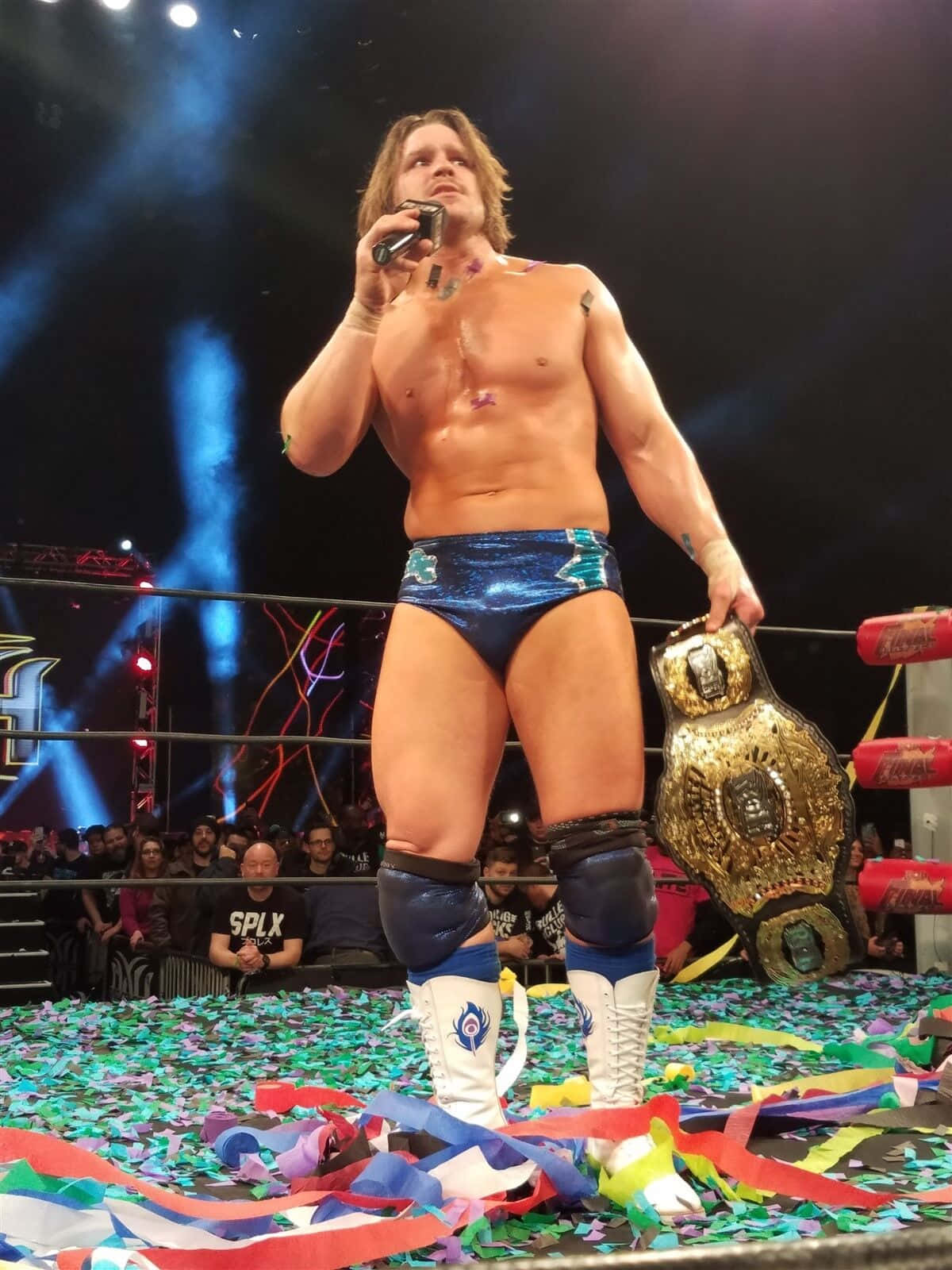 Dalton Castle Triumphantly Holding Aew Championship Belt Wallpaper