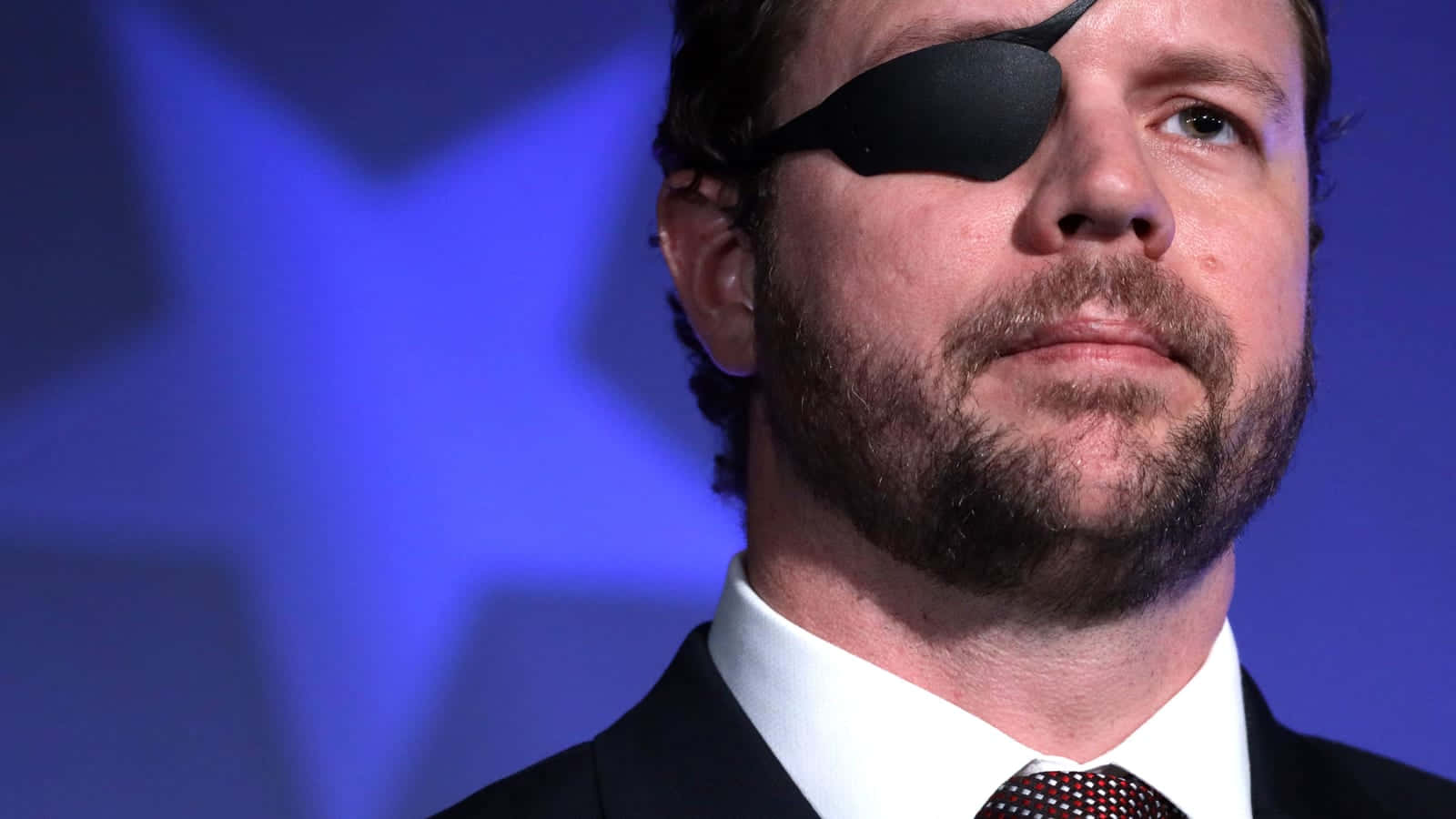 Dan Crenshaw Side Profilewith Eyepatch Wallpaper