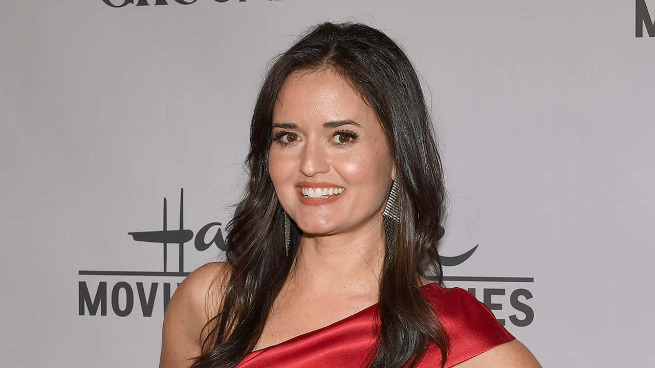 Danica Mckellar Smiling At An Event Wallpaper