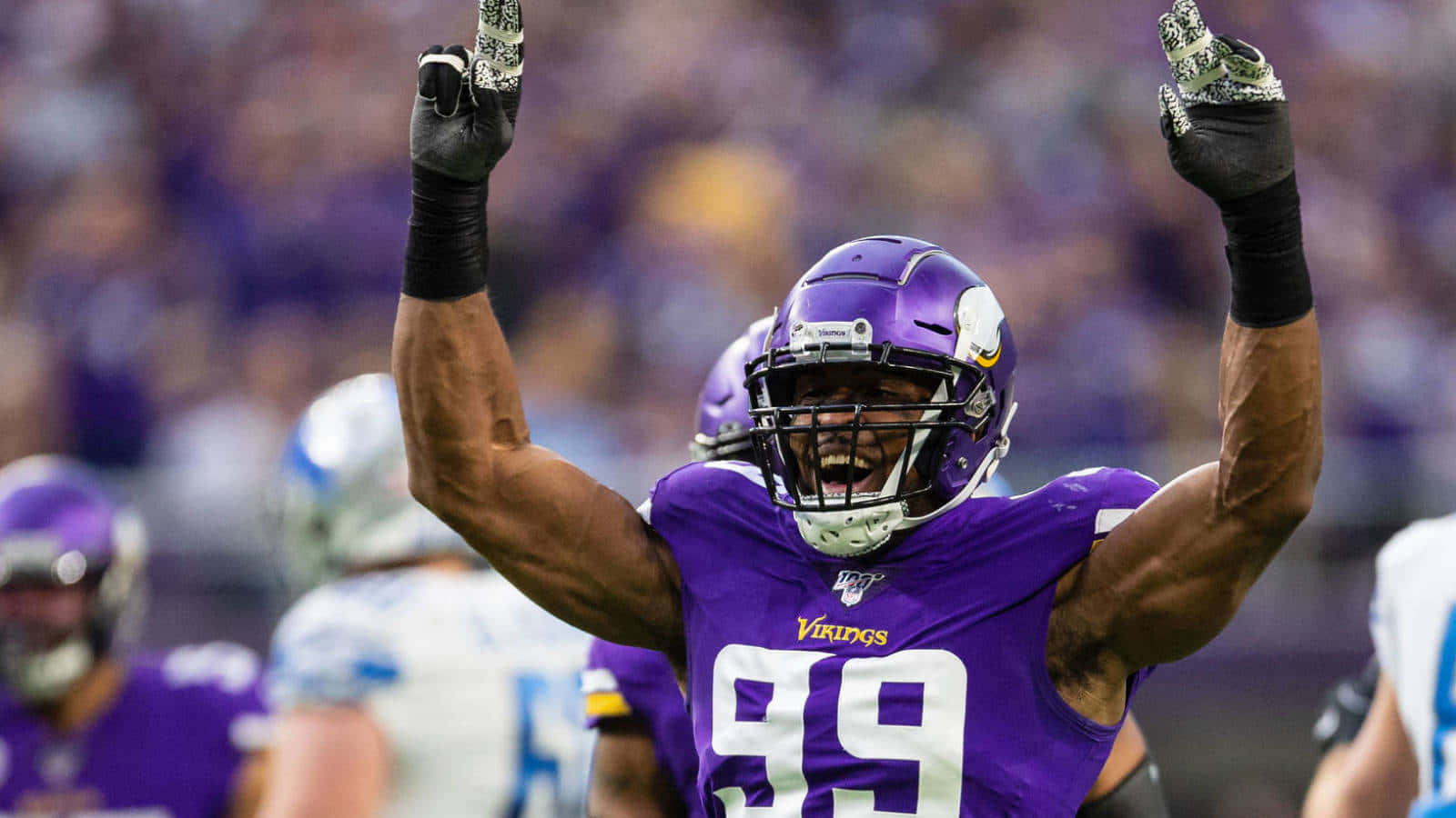 Danielle Hunter Raise Hands Celebrate Win Wallpaper