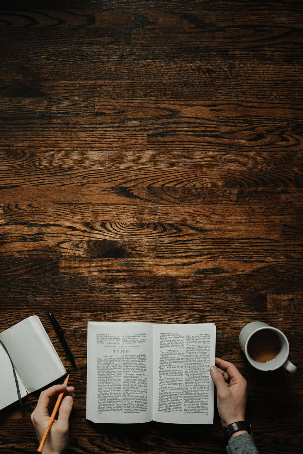 Dark Wooden Deskwith Bookand Coffee Wallpaper