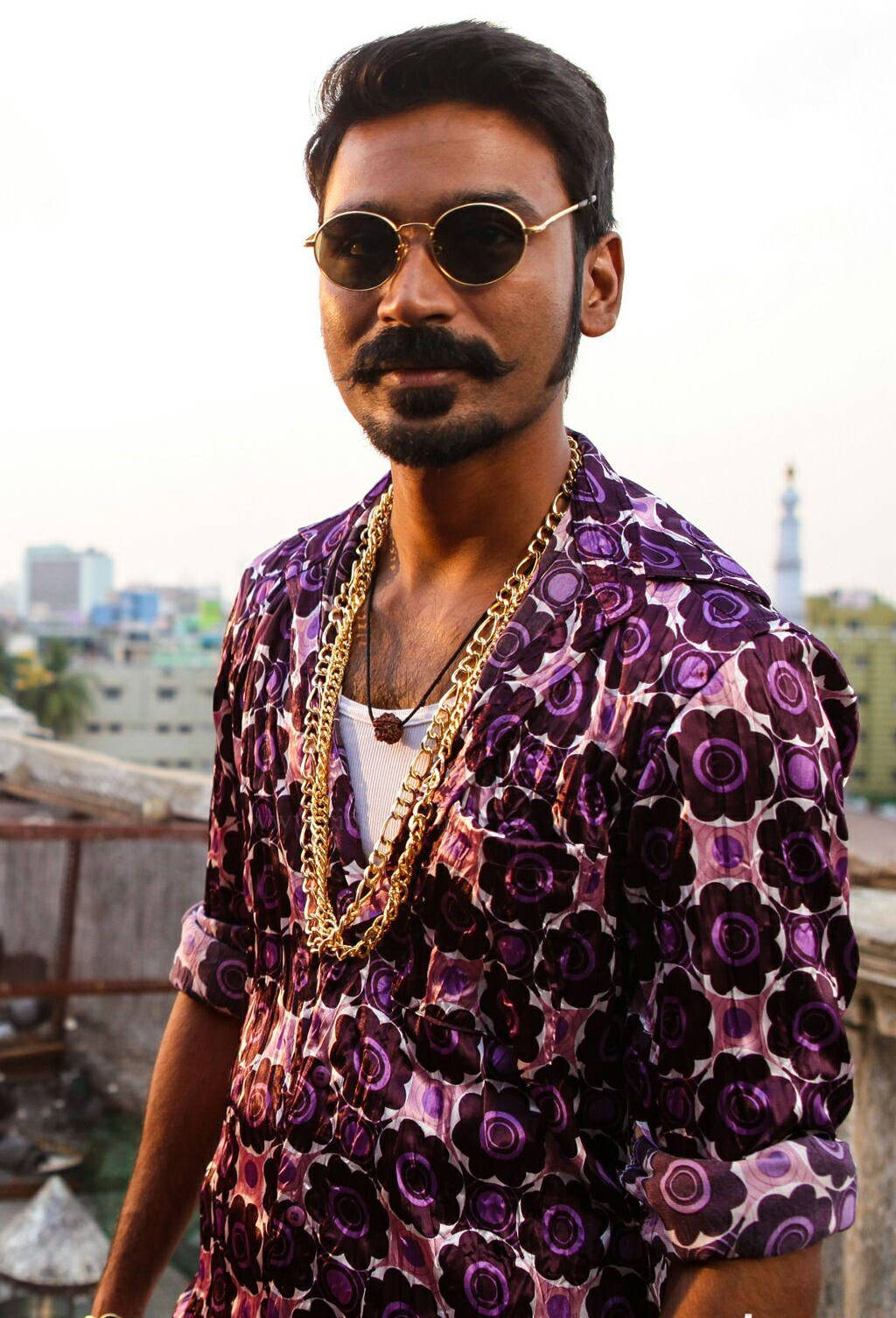 Dashing Dhanush With Gold Chain Wallpaper