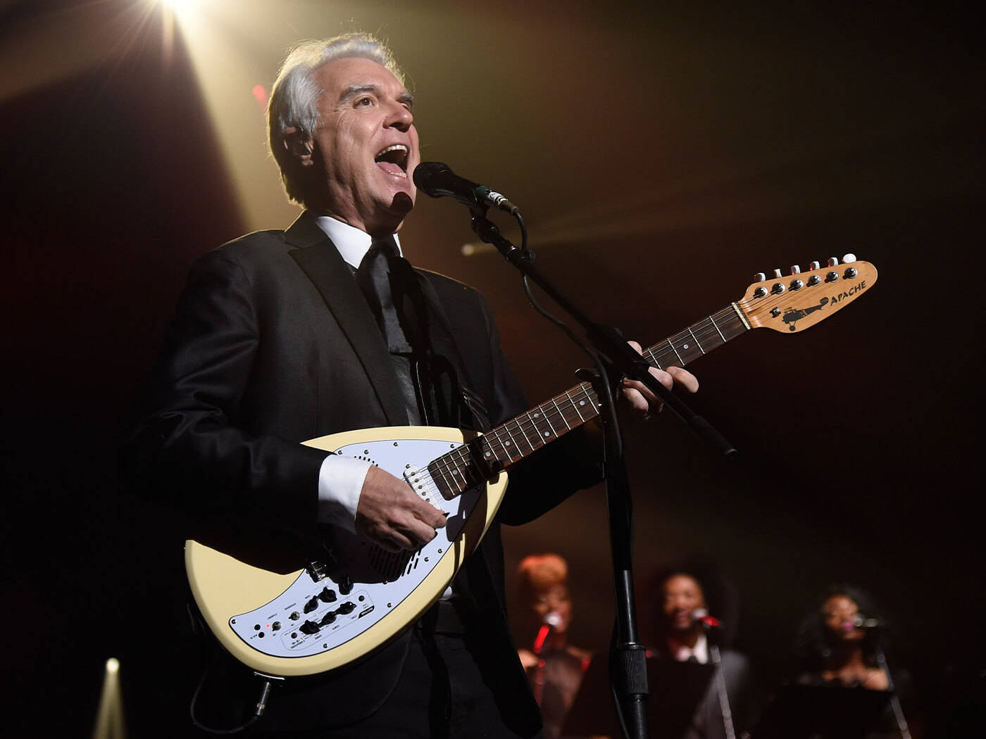 David Byrne Guitarist Concert Photo Wallpaper