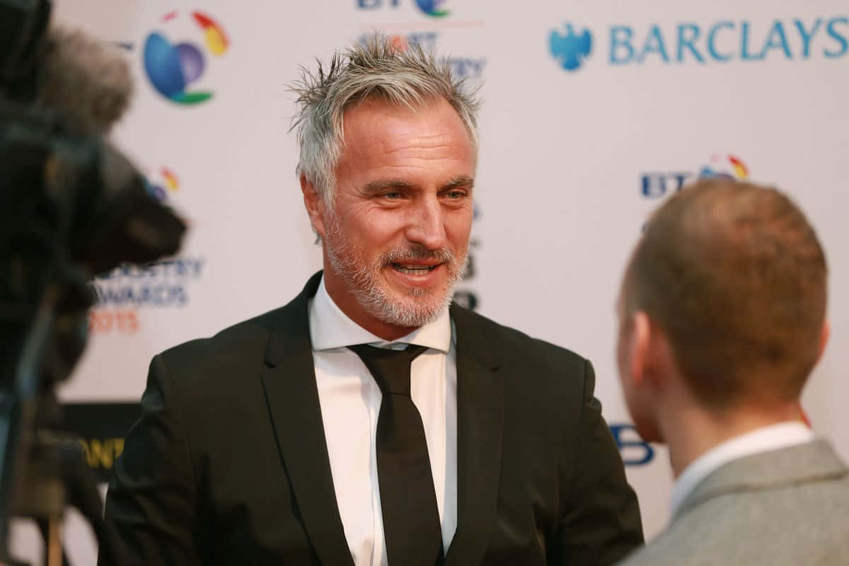 David Ginola: The Football Legend During An Interview Wallpaper