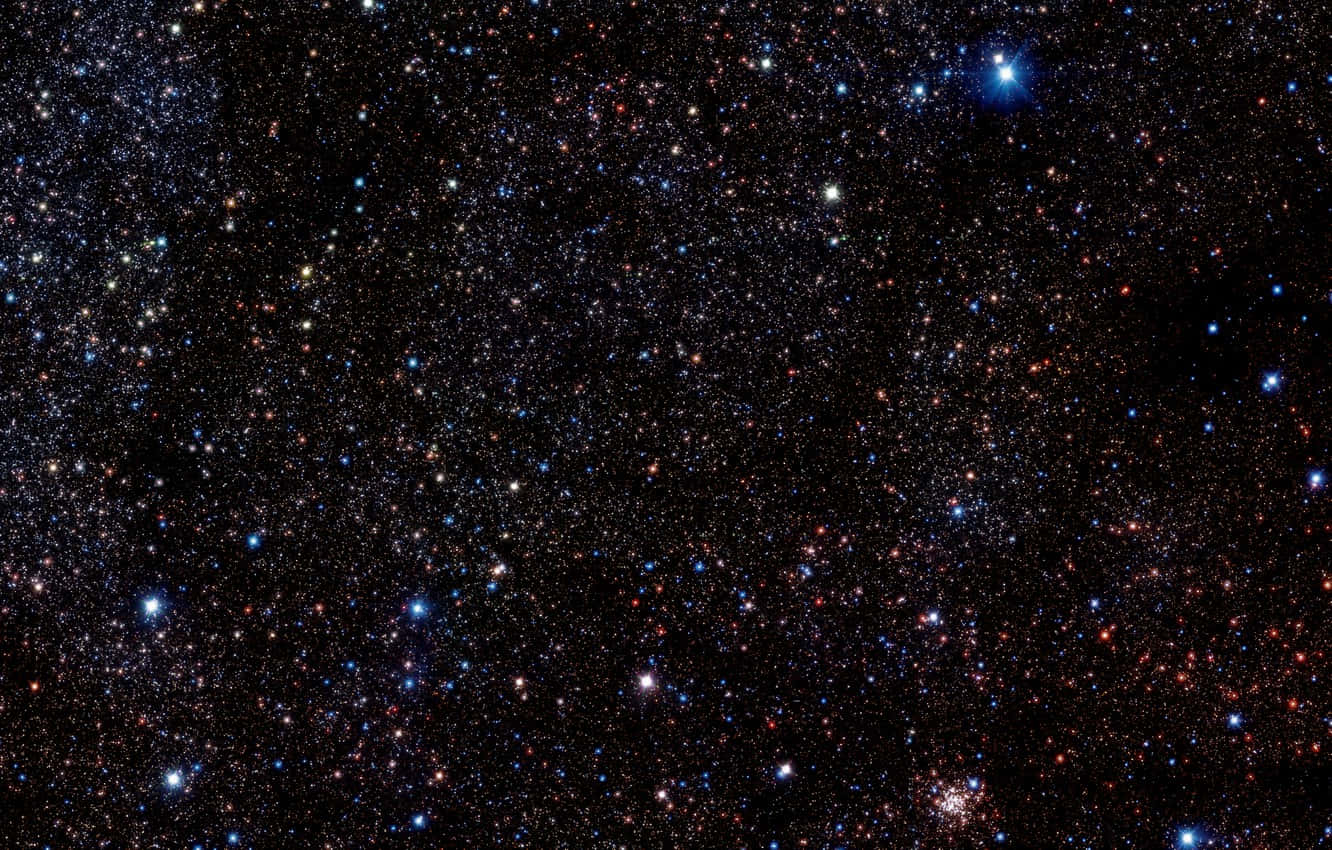 Dazzling Star Cluster Shining Brightly In The Night Sky Wallpaper