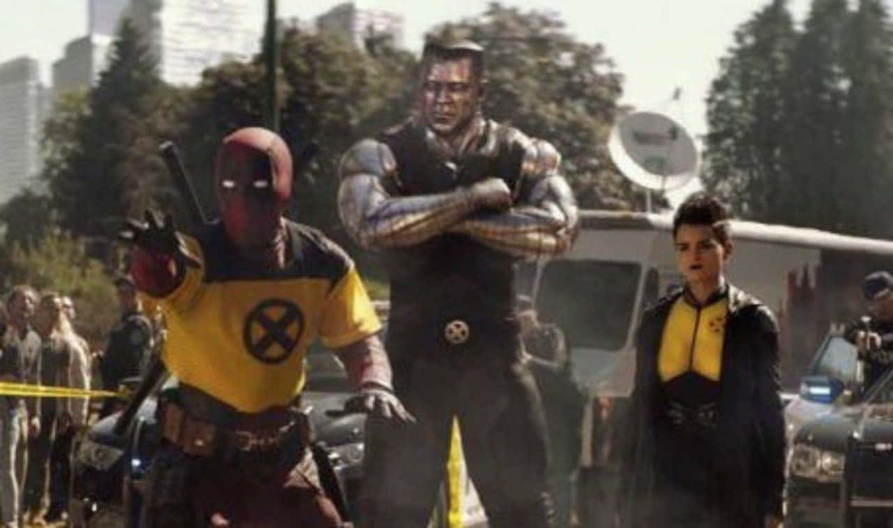 Deadpool And Colossus Team Up In Action Wallpaper