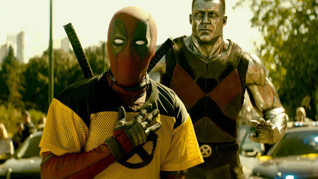 Deadpool And Colossus Teaming Up In Action Wallpaper