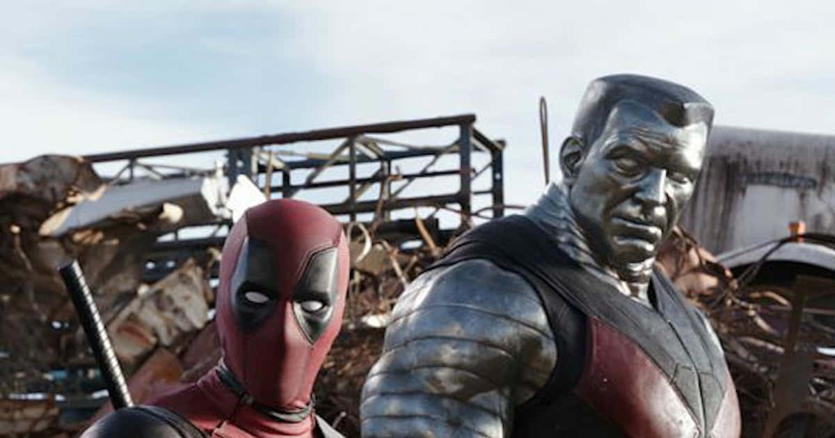 Deadpool And Colossus - Unlikely Allies In Action Wallpaper