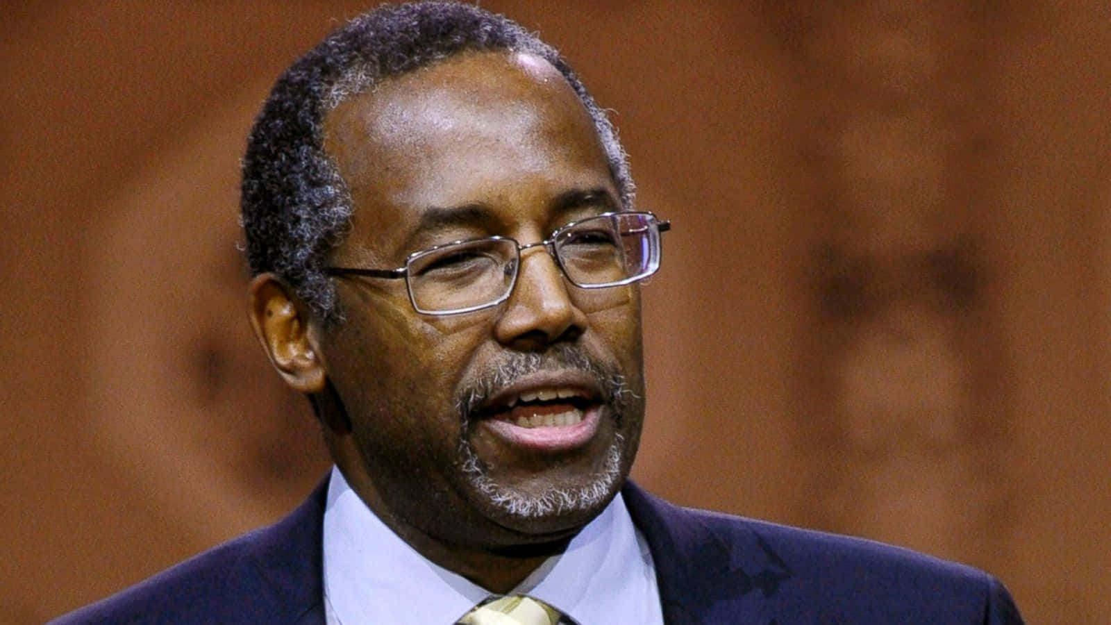 Deep In Thought - A Close-up Portrait Of Ben Carson Wallpaper