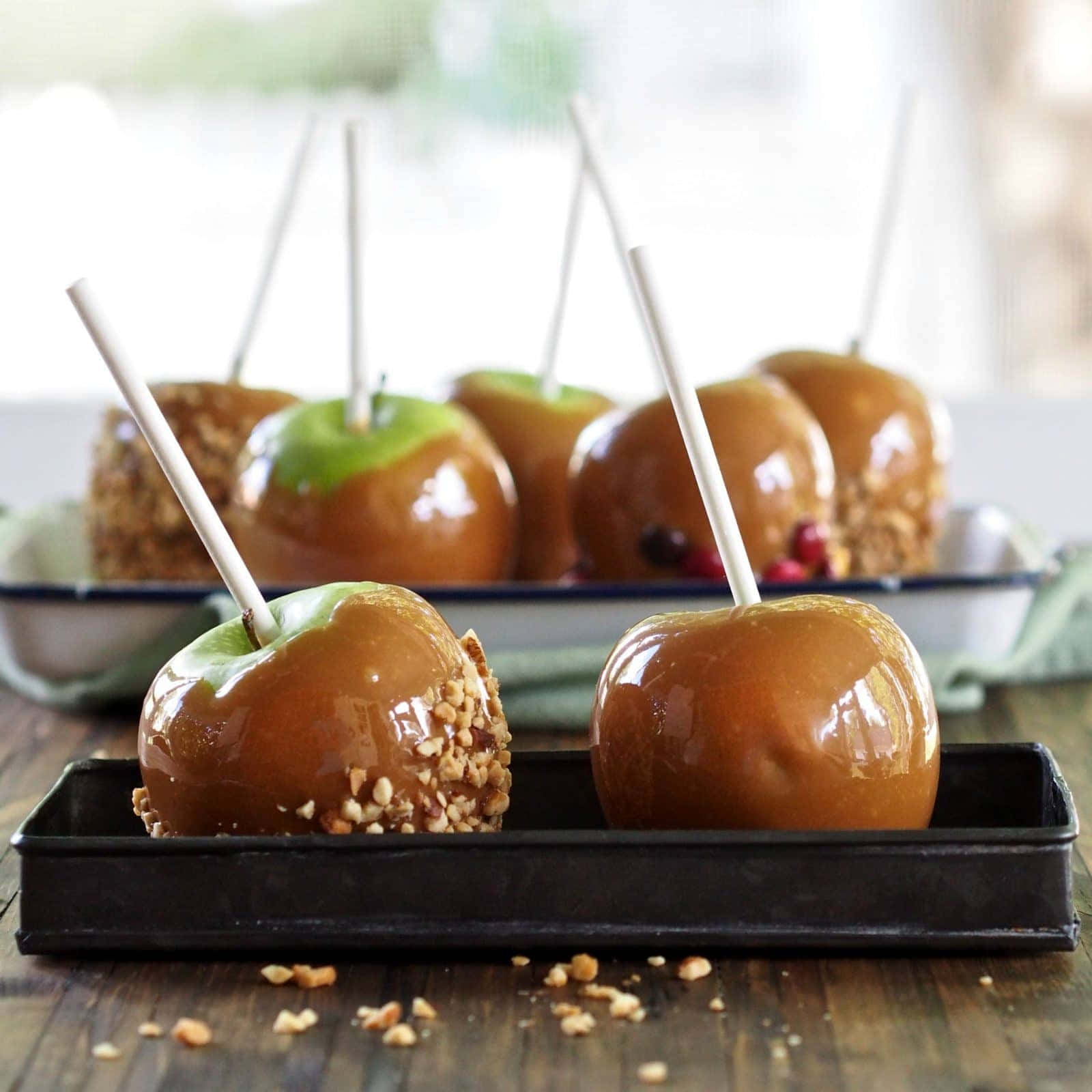 Delectable Caramel Apples On A Stick Wallpaper