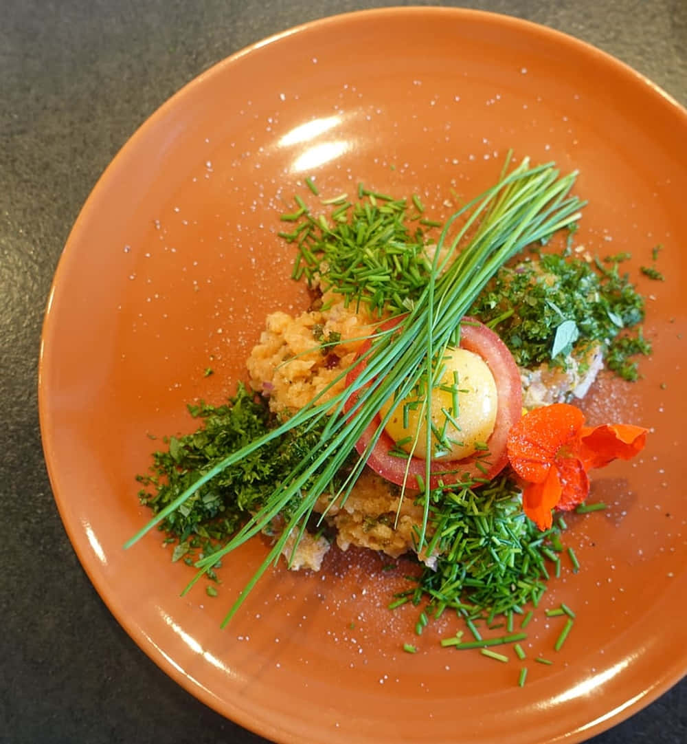 Delectable Ground Salmon Dish Garnished With Green Chives Wallpaper