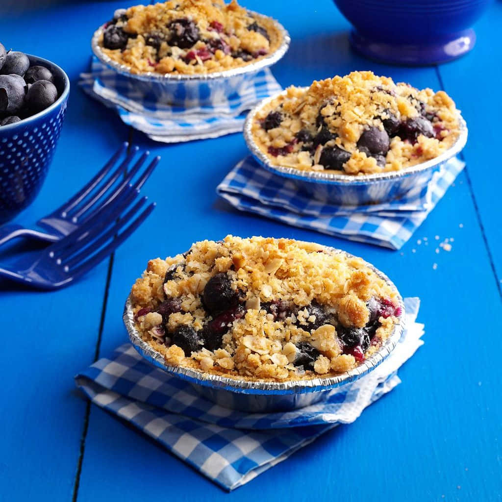 Delicious Blueberry Tart With A Crusty Streusel Topping Wallpaper