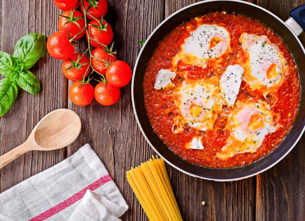 Delicious Homemade Red Sauce In A Ceramic Bowl Wallpaper