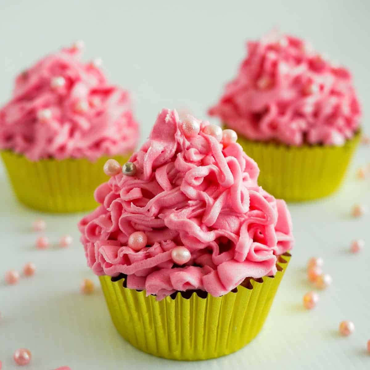 Delicious Pink Cupcakes On Display Wallpaper