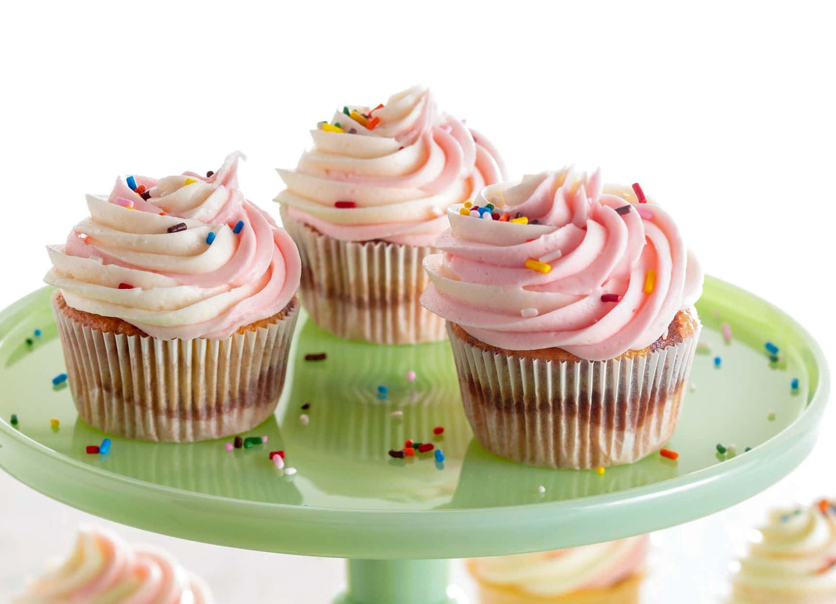 Delicious Pink Cupcakes On Display Wallpaper