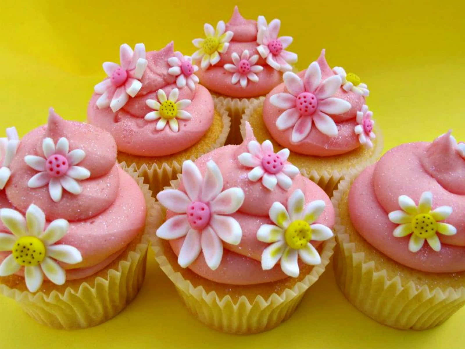 Delicious Pink Cupcakes On Display Wallpaper