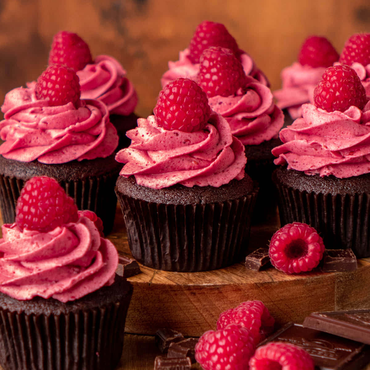 Delicious Pink Cupcakes With Whipped Cream And Sprinkles Wallpaper