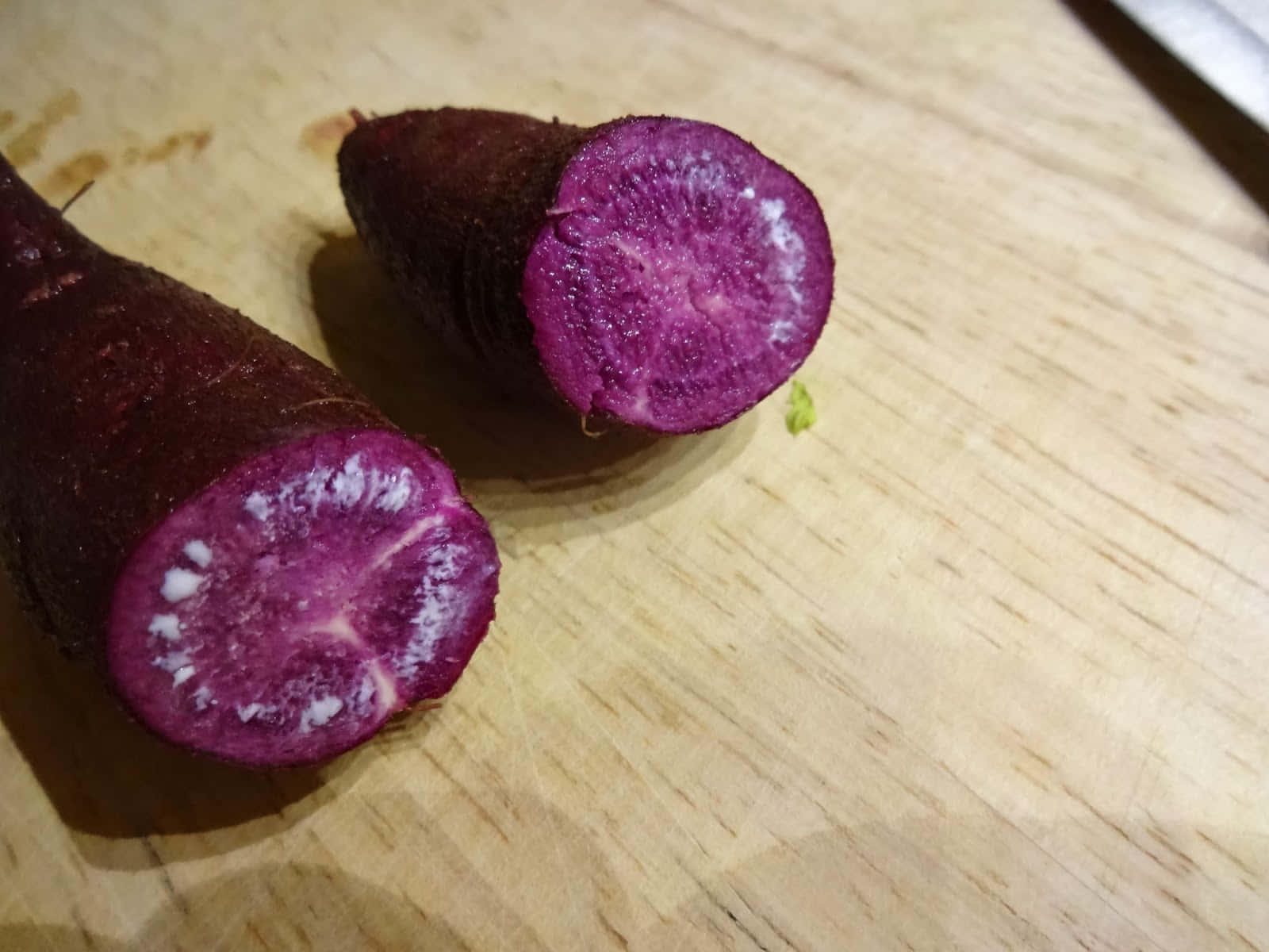 Delicious Purple Potatoes Surrounded By Rosemary And Oregano Wallpaper