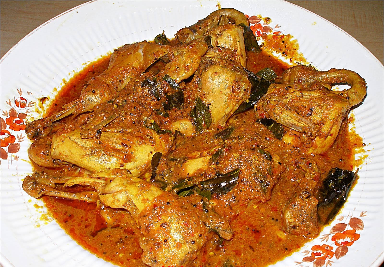 Delicious Quail Tomato Curry Dish Wallpaper