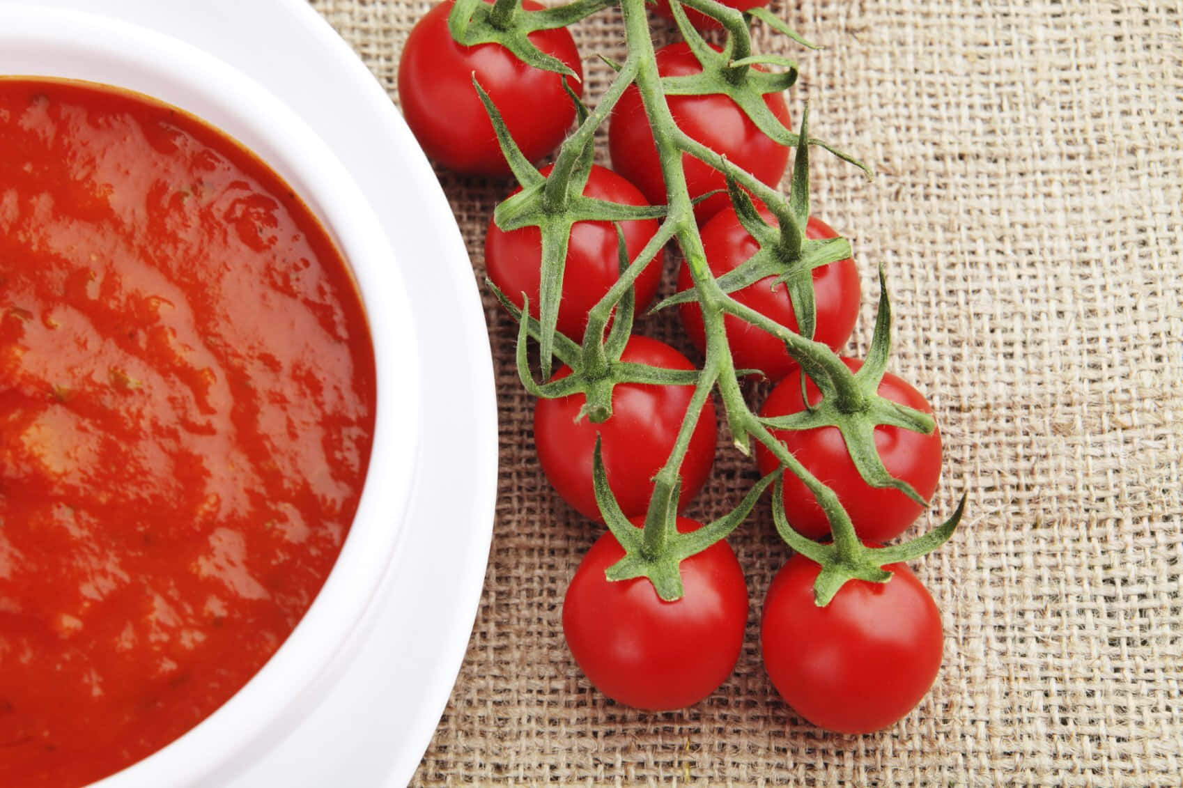 Delicious Red Sauce Simmering In A Pan Wallpaper