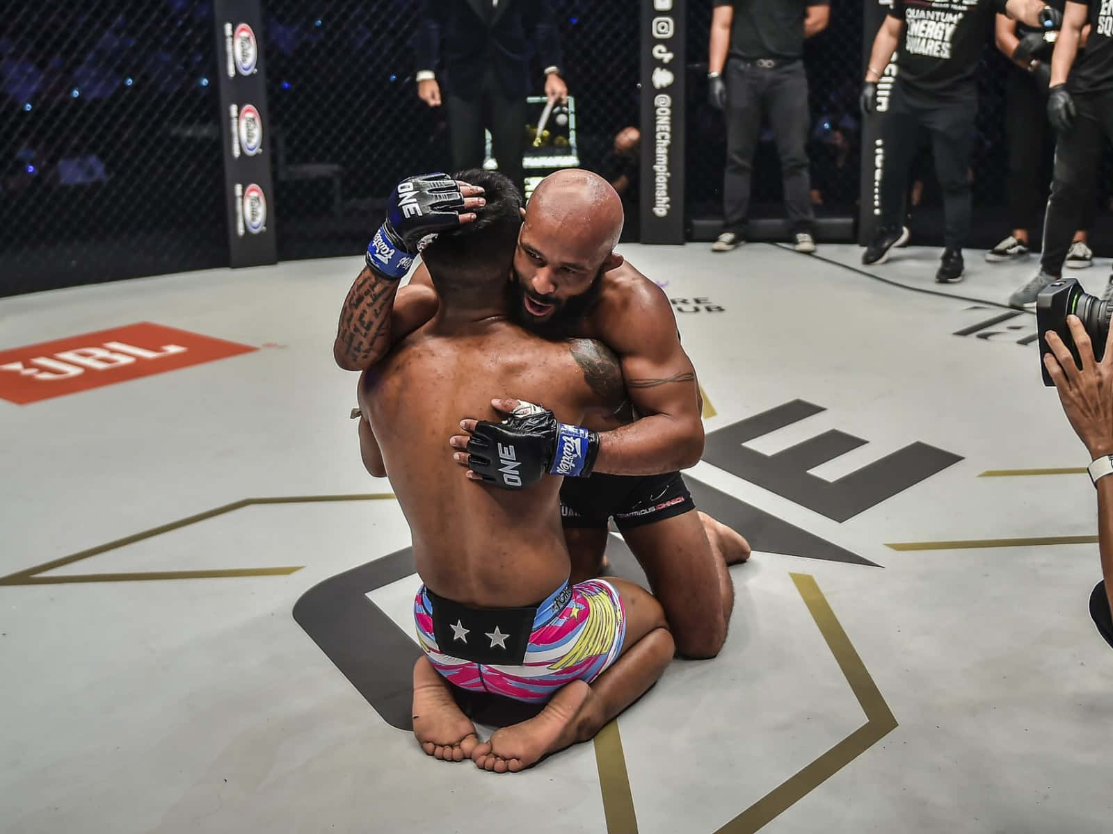 Demetrious Johnson And Rodtang Jitmuangnon Mma Muay Thai Match Wallpaper