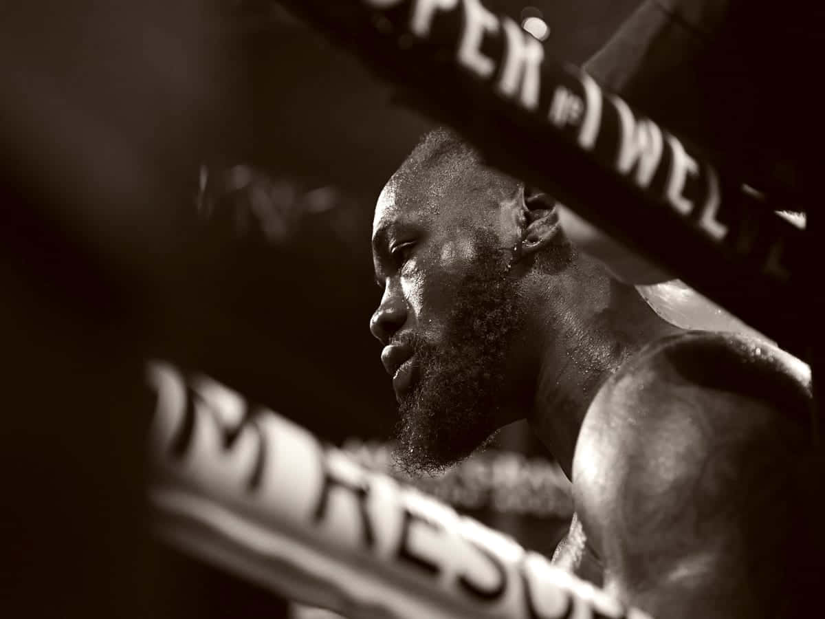 Deontay Wilder Contemplative Moment Ringside Wallpaper