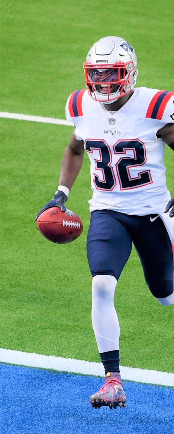 Devin Mccourty In Action During A Football Game Wallpaper