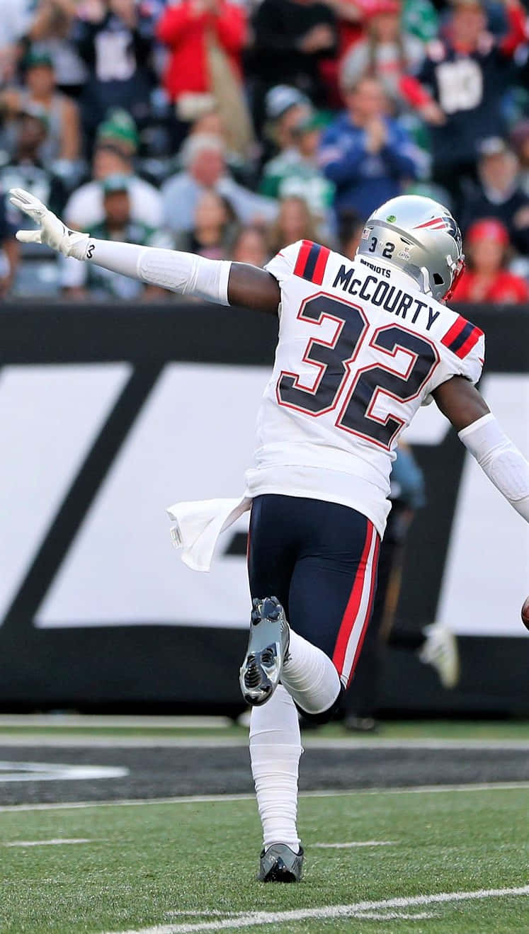 Devin Mccourty In Action During A Game Wallpaper